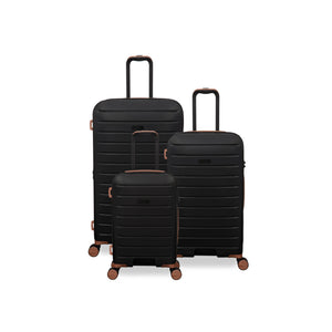 Set of three black suitcases with rose gold handles and wheels on a white background