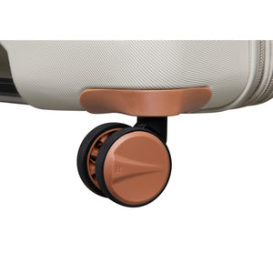 Close-up of a suitcase wheel on a white background