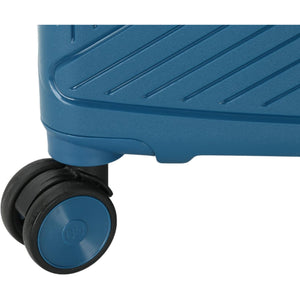 Close-up of a blue suitcase wheel on a white background