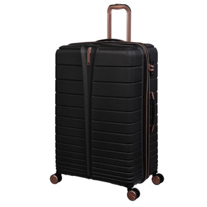 Black cabin bag with bronze handles and wheels on a white background