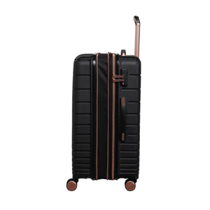 Black cabin bag with gold accents on a white background