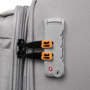 Gray suitcase with a lock attached, featuring orange and black handles.
