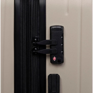 Close-up of a beige suitcase with a black zipper and lock mechanism.