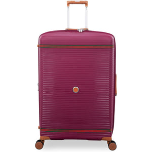 Red large hard shell travel luggage
with a textured surface on a white background