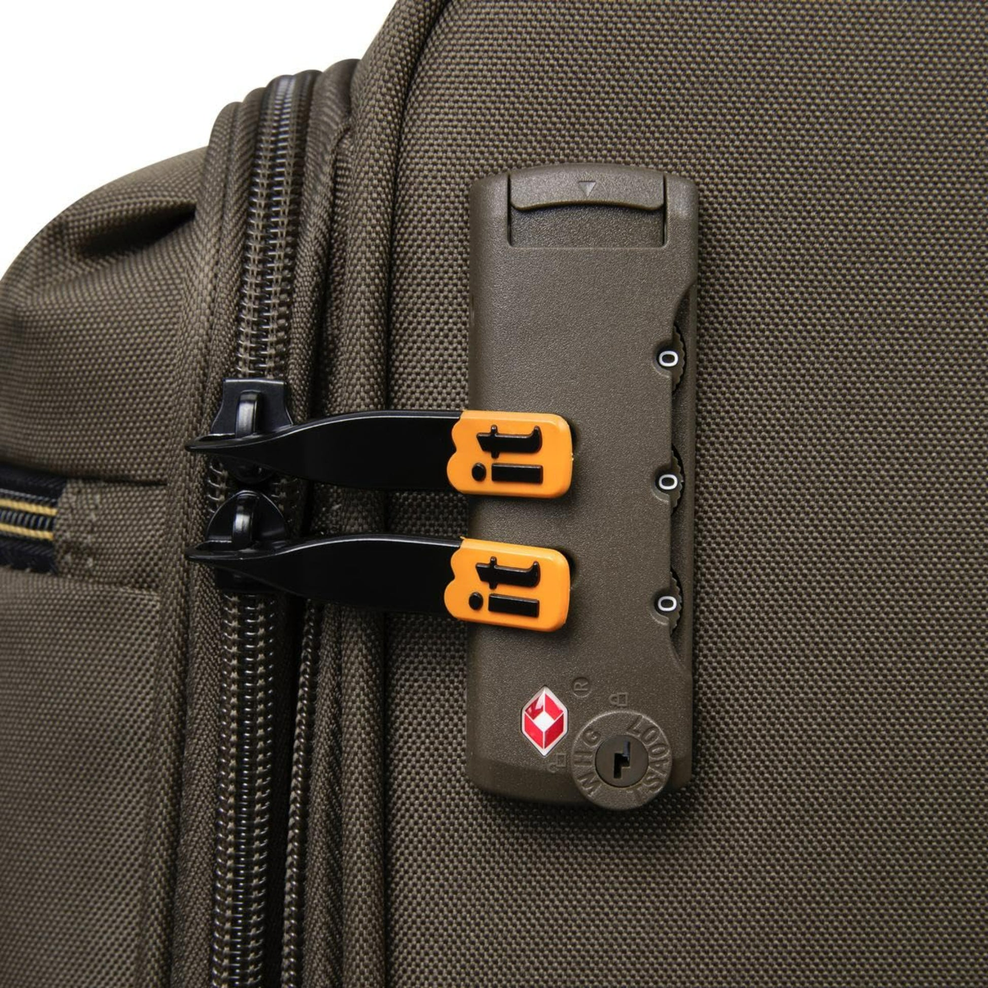 Close-up of a brown travel bag for men with a zipper and a lock mechanism featuring orange handles.