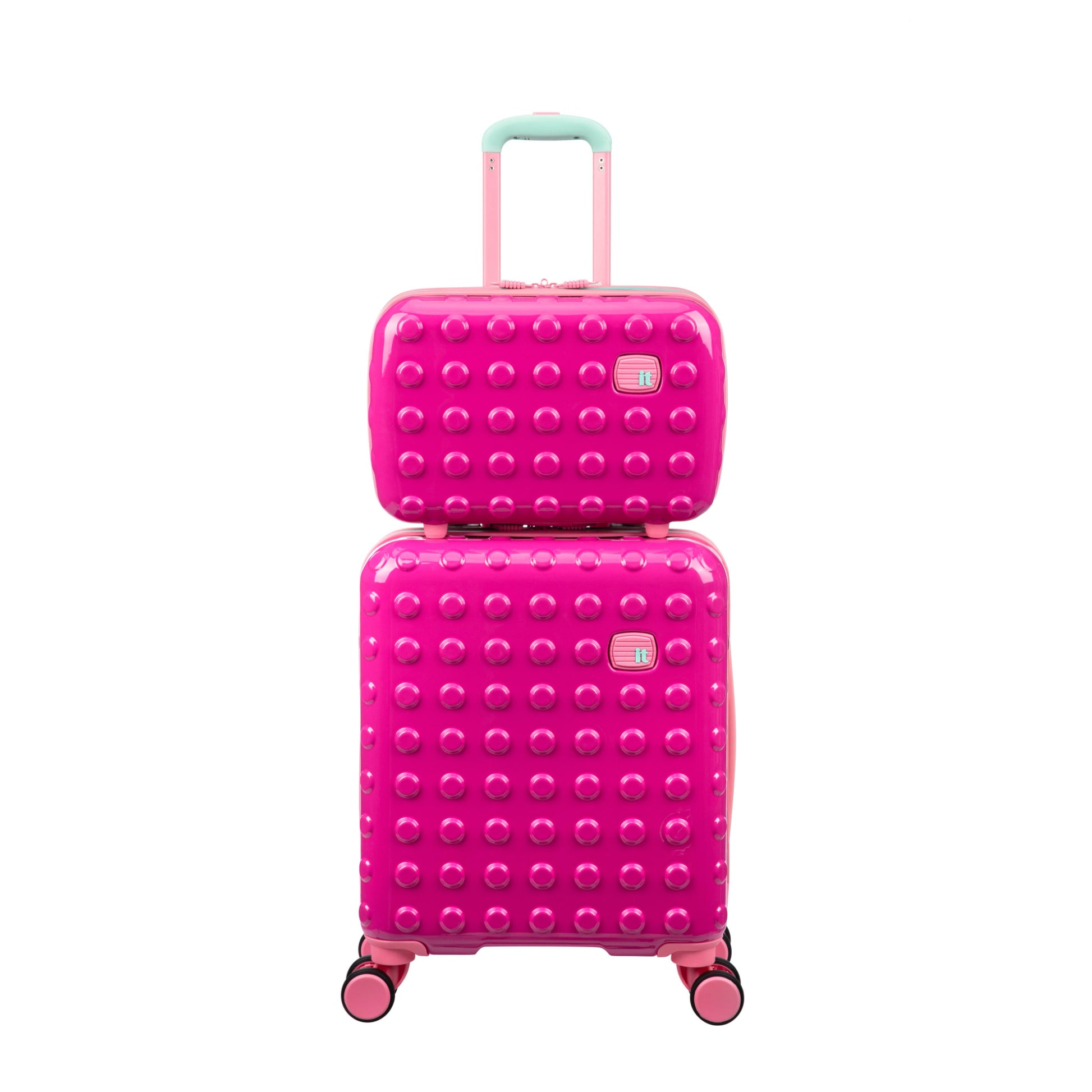 Pink textured suitcase with matching smaller suitcase on a white background